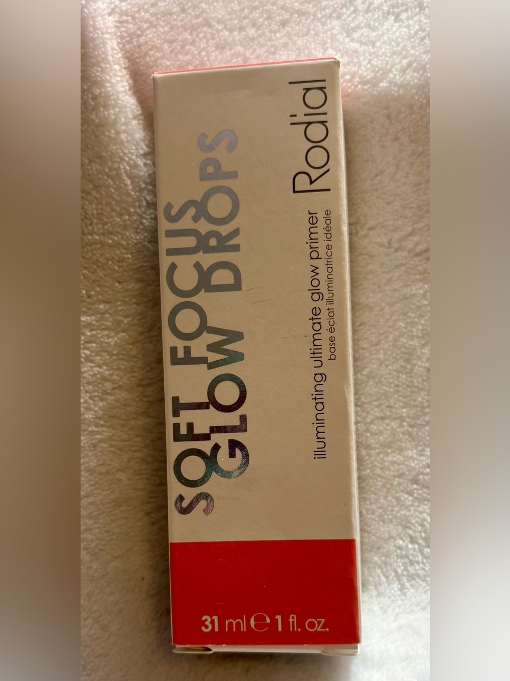Rodial Soft Focus Glow Drops Illuminating Primer - Cream and Red Accents